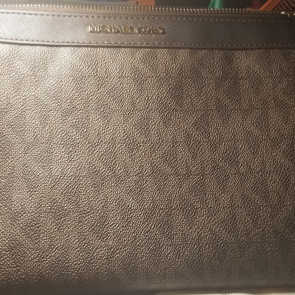 Michael Kors large wristlet.